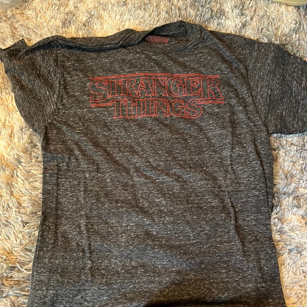 size small. dark grey with stranger things logo